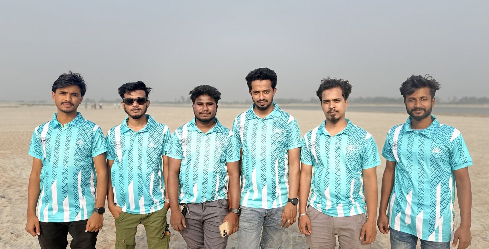 নদীর চরে একই জার্সিতে Life Review Team-এর ছয় সদস্য